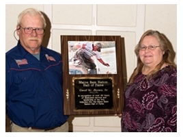 Dave Barnes Sr with his wife and Hall of Fame plaque