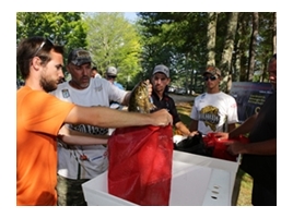 Bass club preparing to weigh a bass